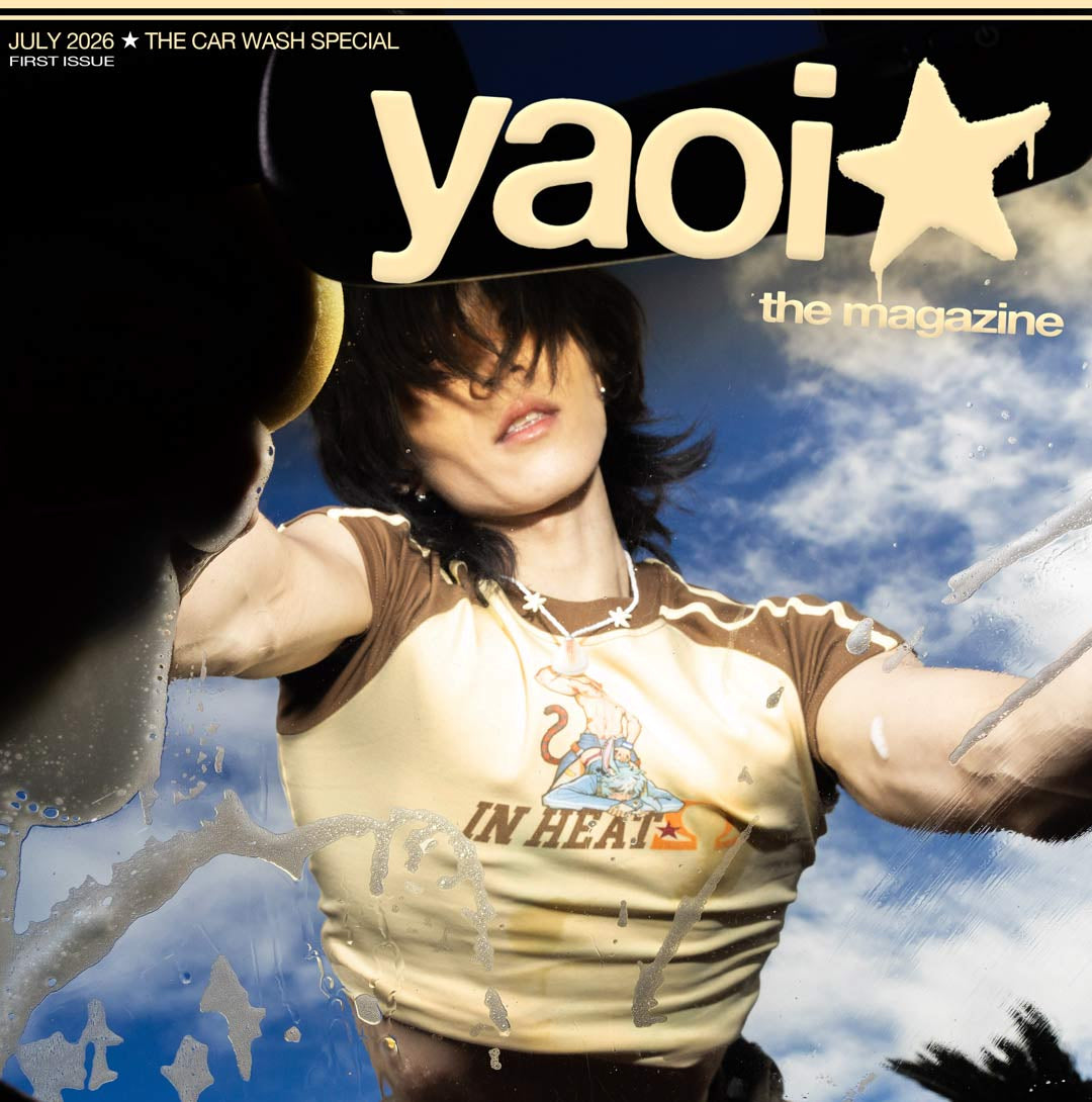 Cover of 'yaoi' magazine with a person in a car wash, featuring the title and issue details.